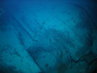Large pieces of twisted steel plate on seabed